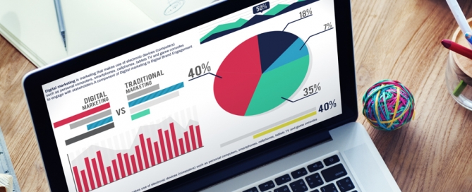 laptop with marketing graphs