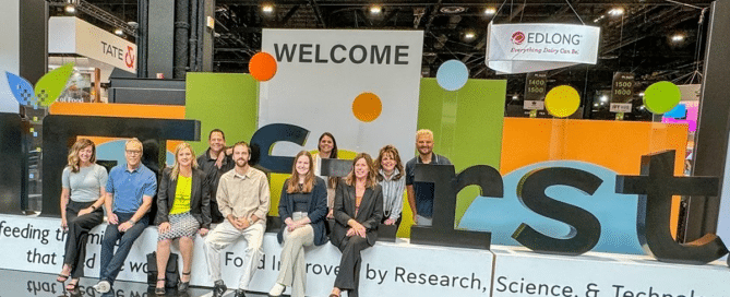 ck team sitting on IFT sign