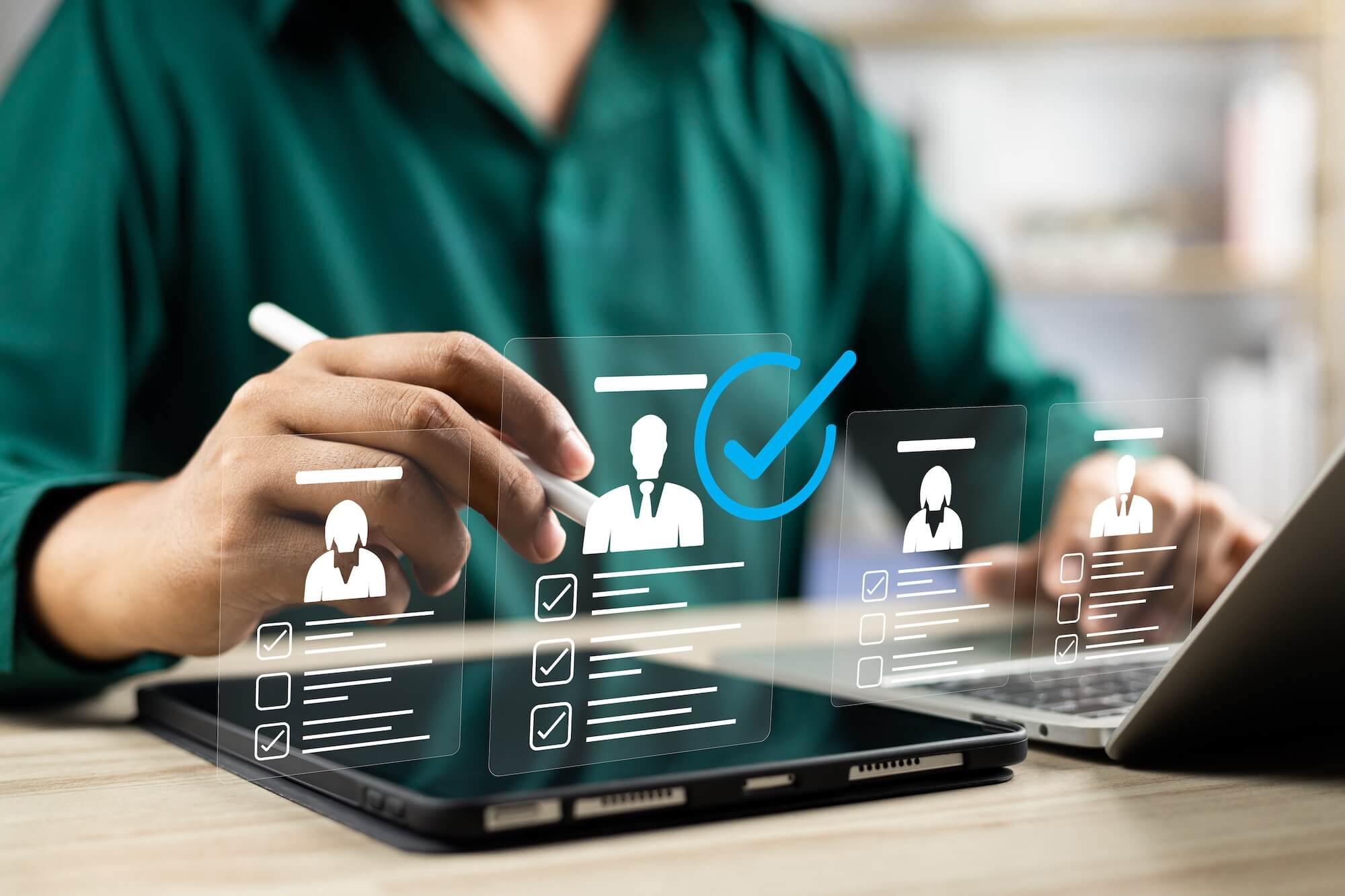 person working on tablet with icons of customers floating above